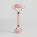 Masajeador de cuarzo rosa con doble rodillo